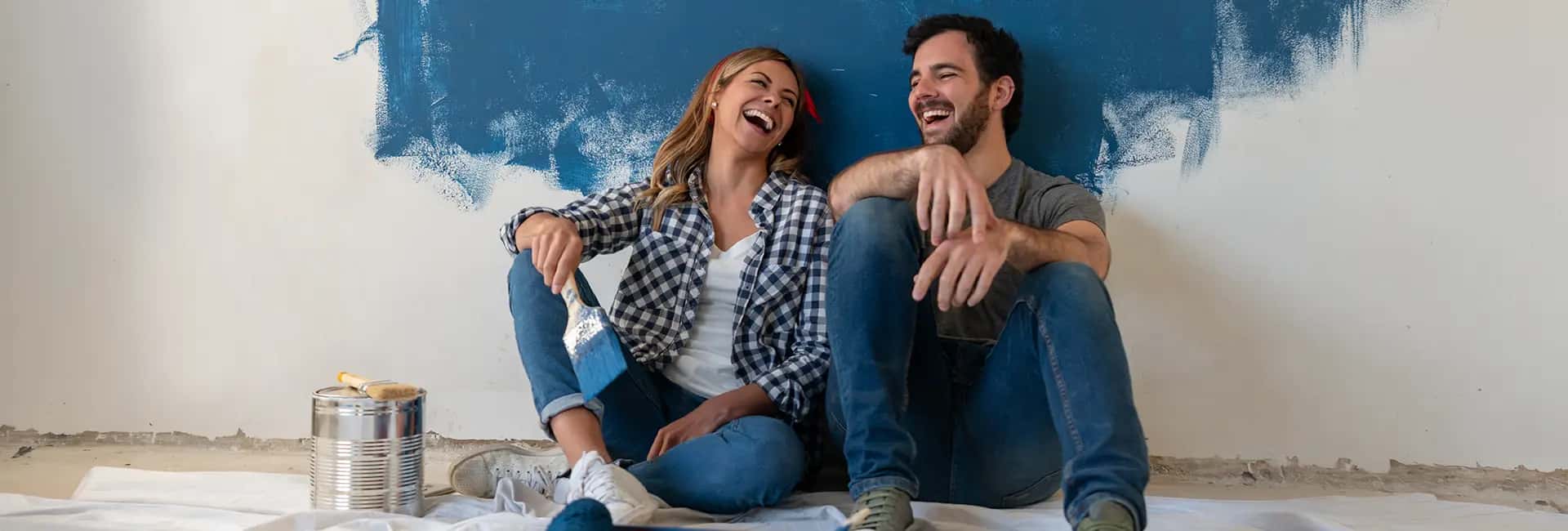 Young couple decorating their home