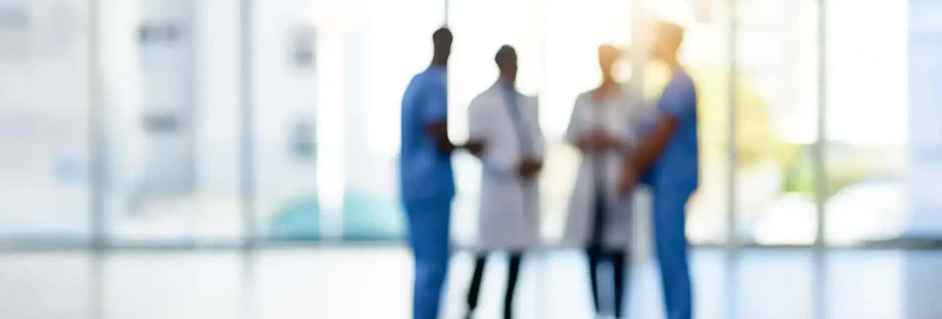 Silhouette of four healthcare professionals