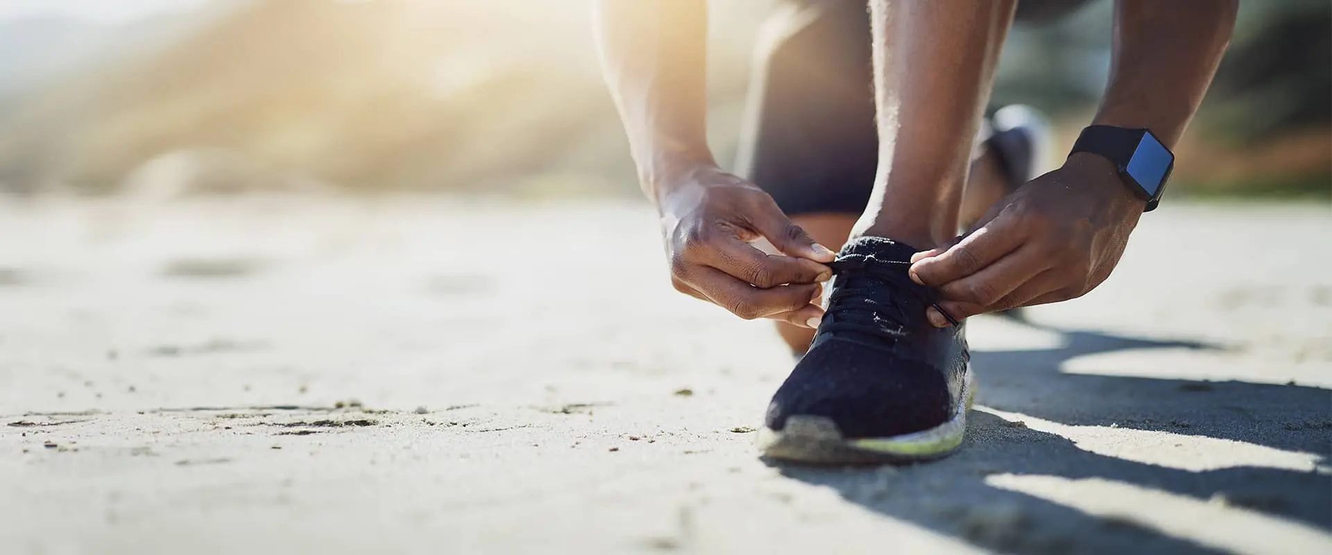 Runner tying up shoes laces
