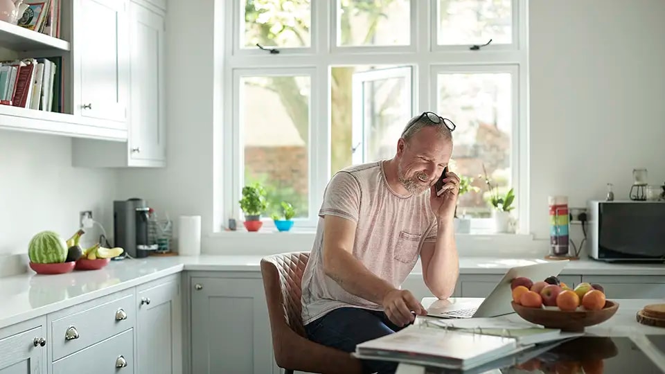 Man using laptop to make a health insurance claim