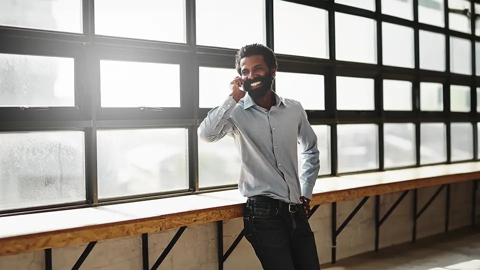 Smiling businessman talking on a mobile phone