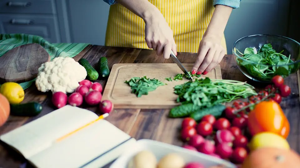 Person chopping vegetables