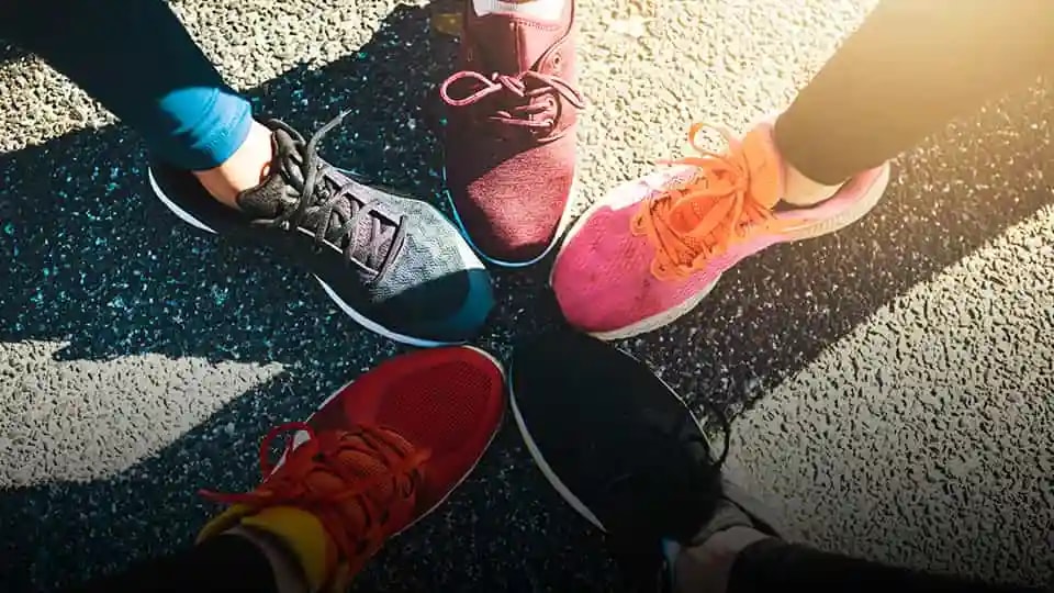 Running shoes touching forming a star shape