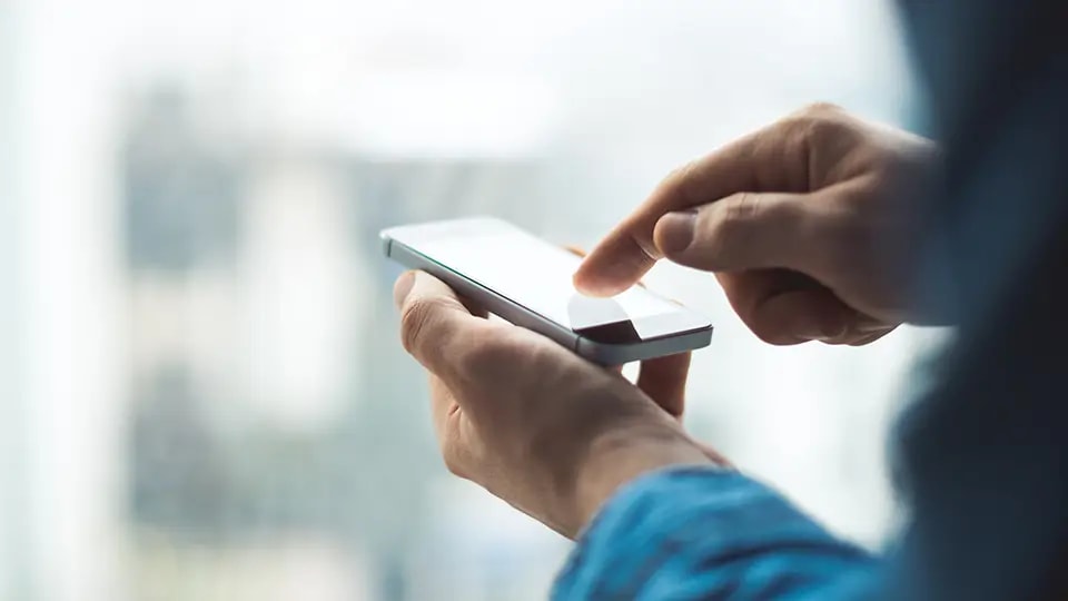 Person using smartphone to access WPA Health app
