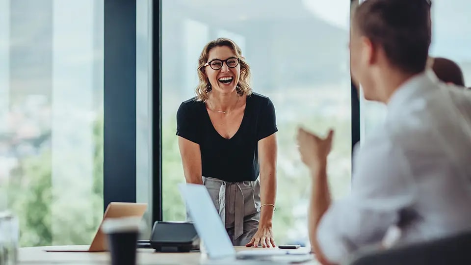 Professional looking woman smiling at work