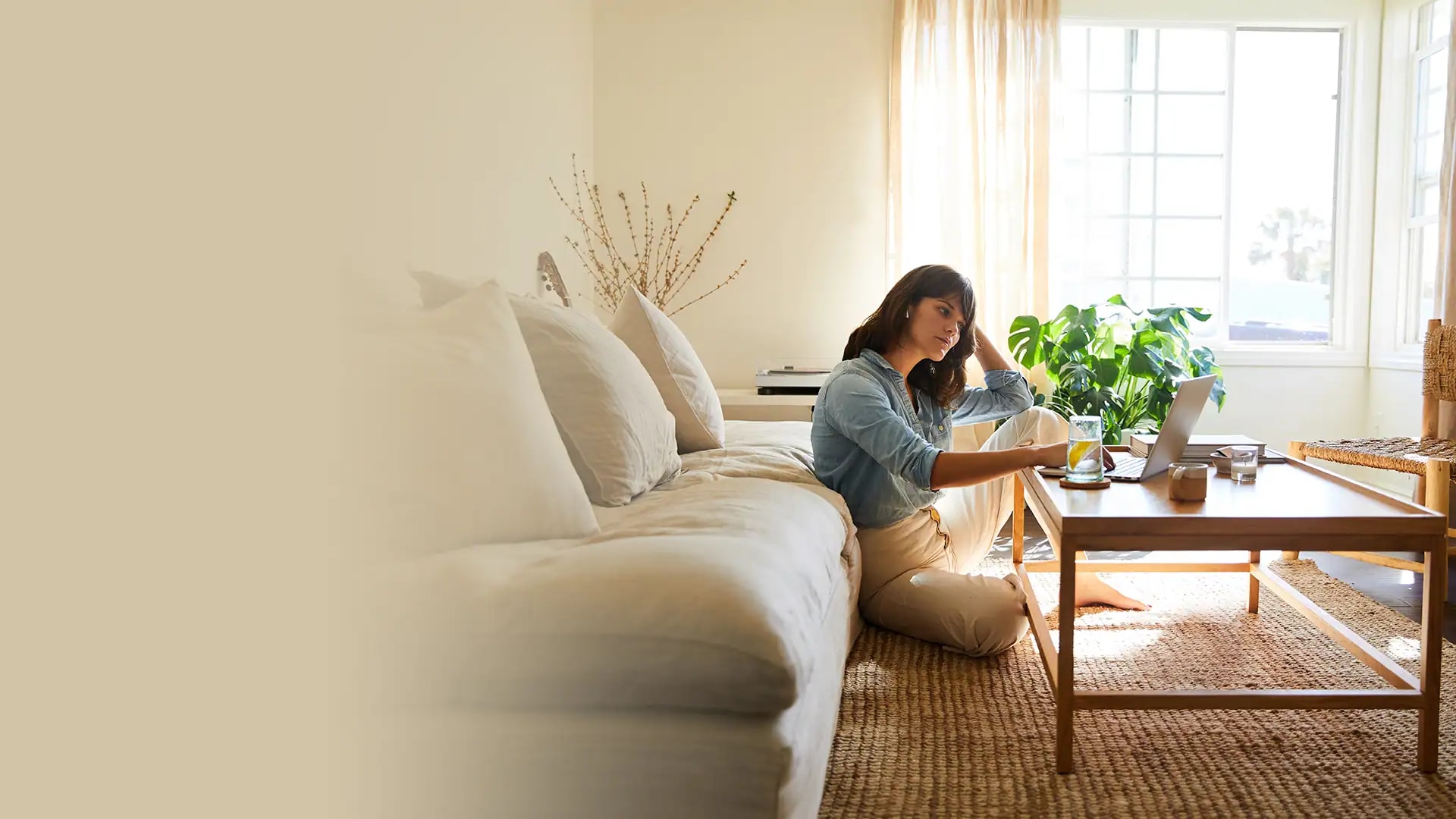 Woman at home using laptop
