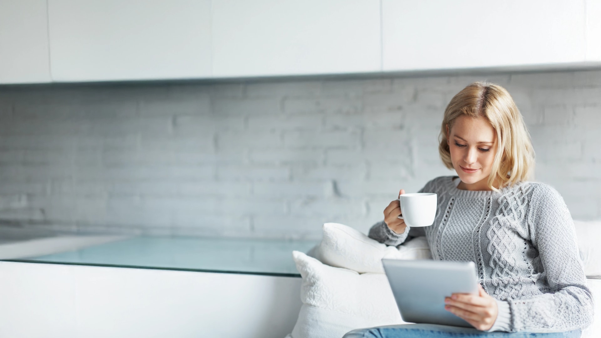 Lady with Tablet Drinking Tea