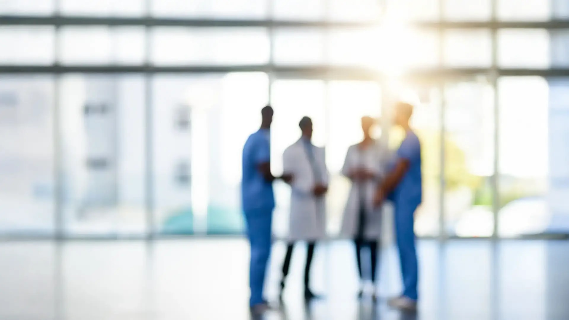 Silhouette of four healthcare professionals