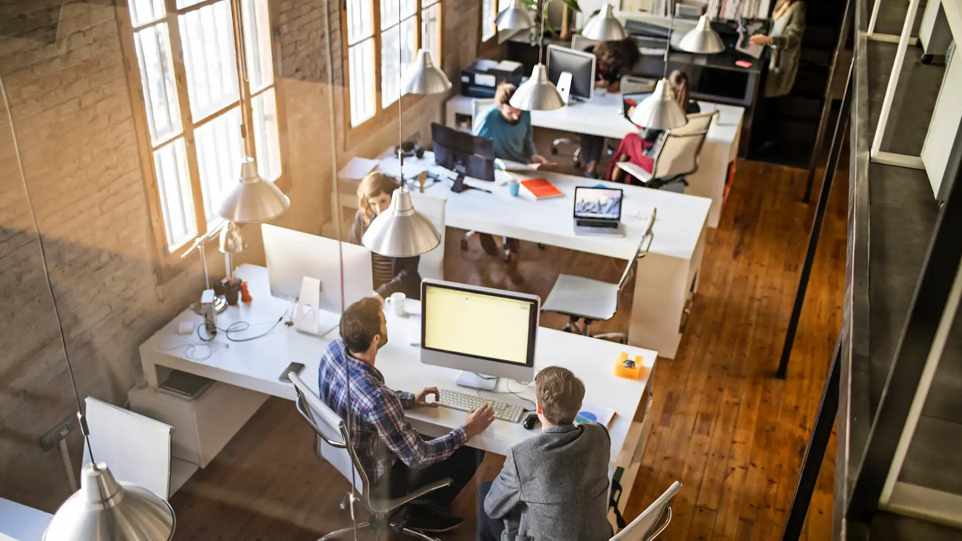 Office environment with staff working at computers
