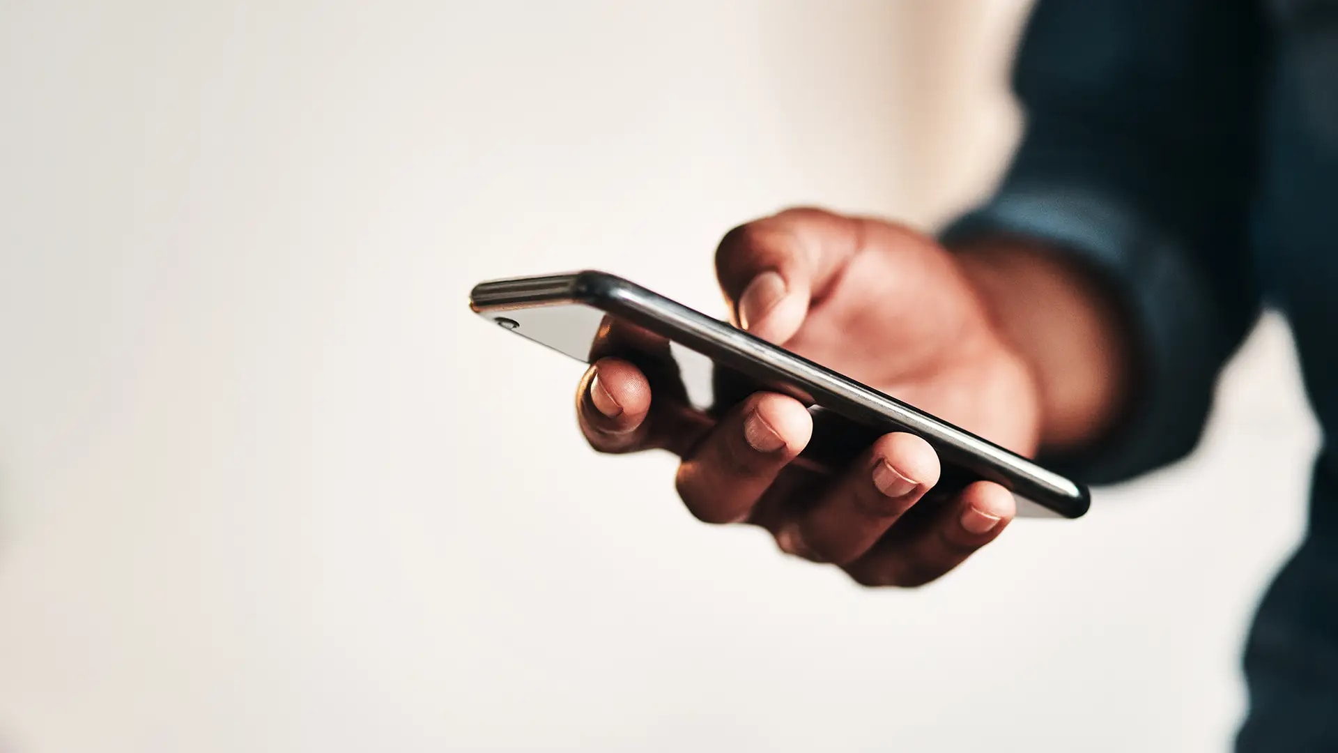 Hand holding a mobile phone