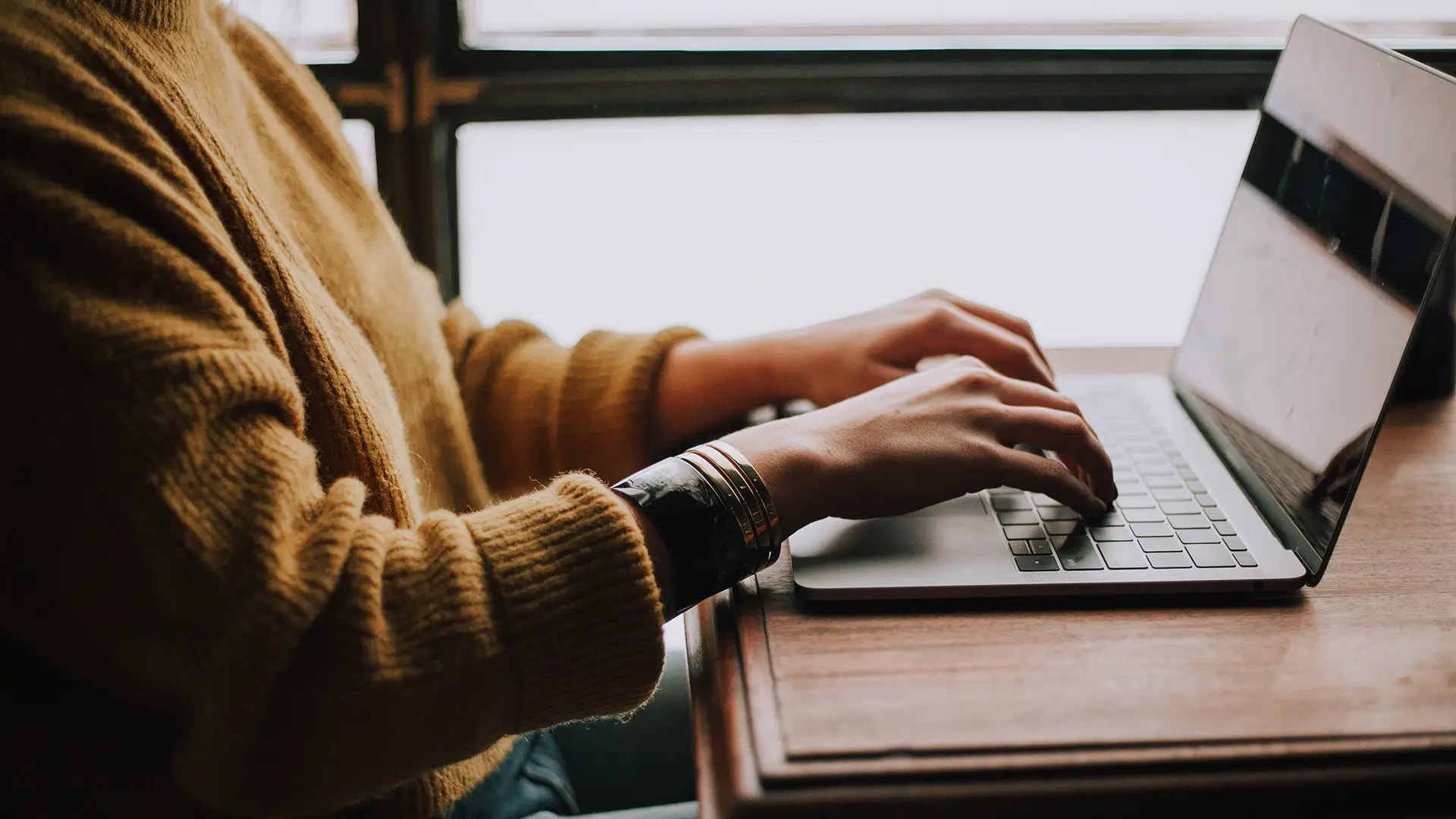 Woman using laptop to access member resources