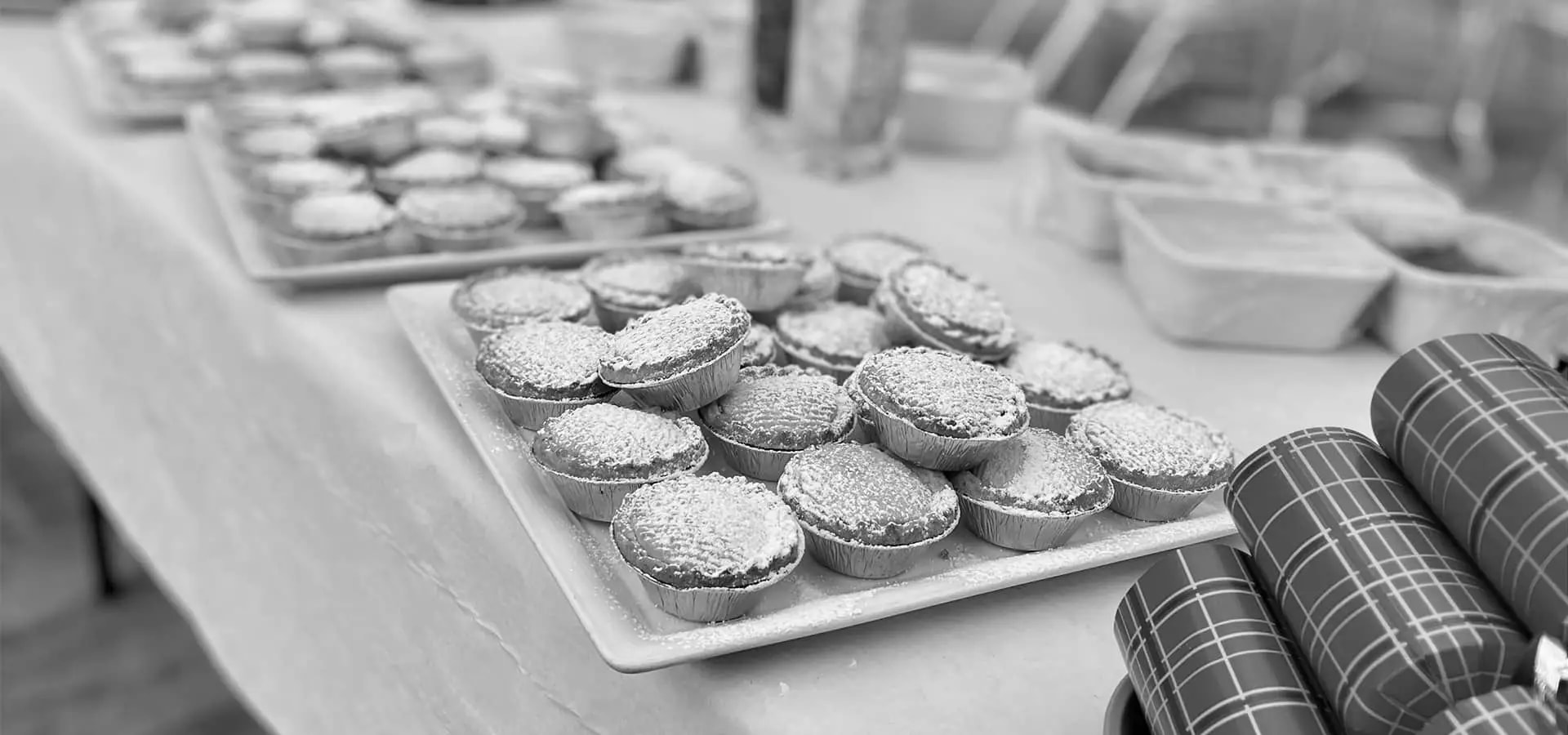 A table with mince pies and crackers