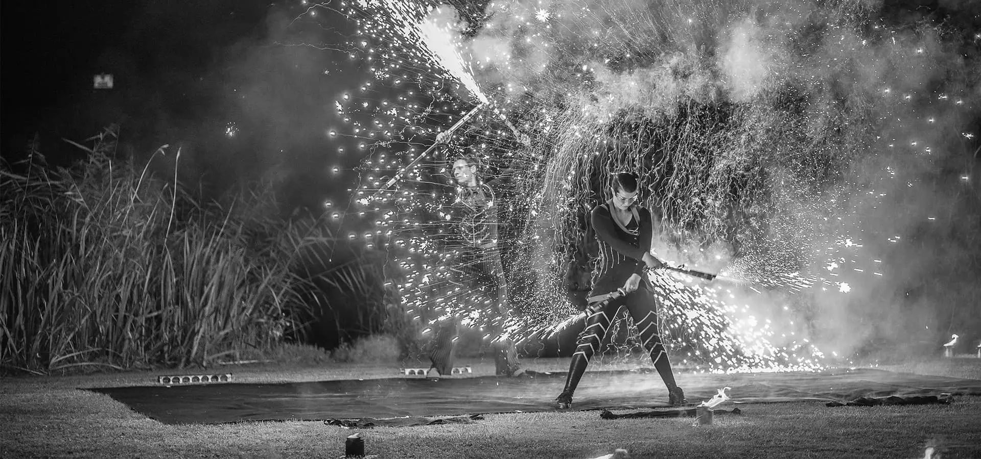Female performer with fire sticks at WPA late summer party