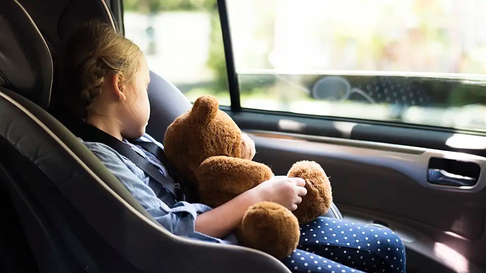 Girl holding teddy bear