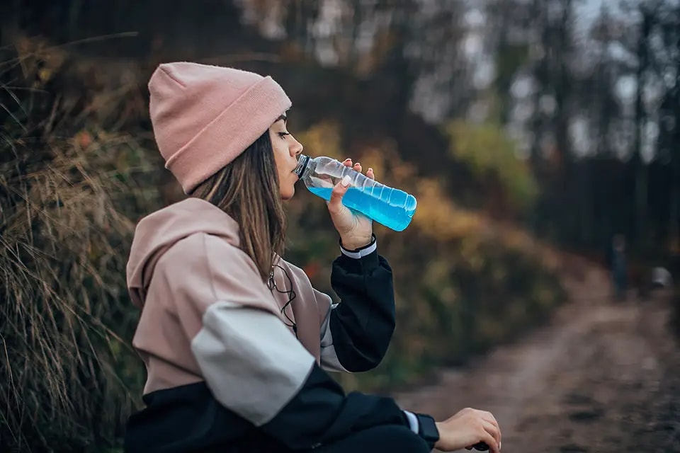 Woman drinking an energy drink