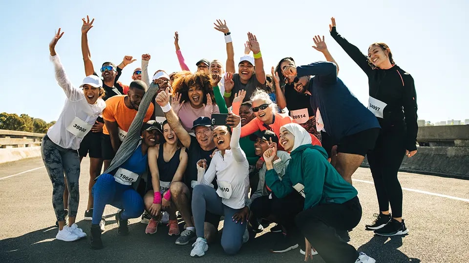 Large group of people posing for photo during a charity run