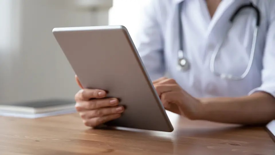 Doctor holding tablet